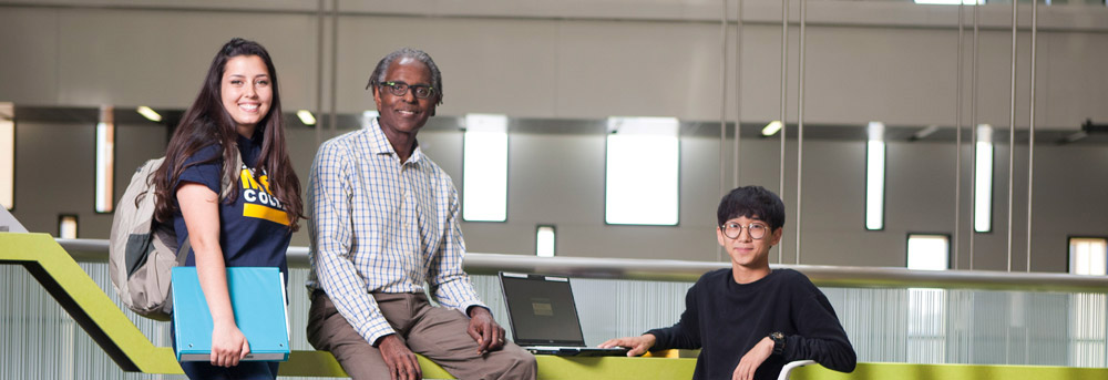 an instructor and two students at the transfer center at mesa college