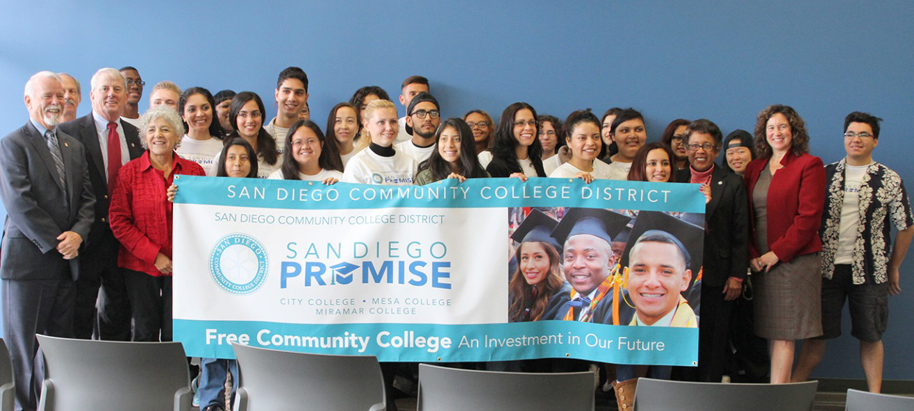 Students in the Promise Program hold up a San Diego Promise banner