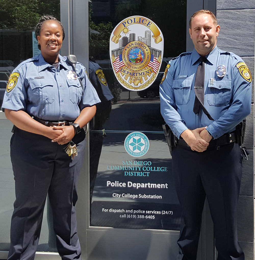 Two campus service officers wearing the new blue uniforms