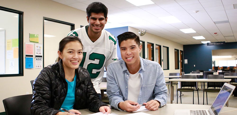 Three students studying at a table at mesa college