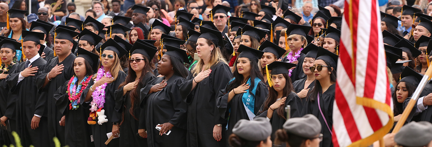 Students pledge allegiance during graduation