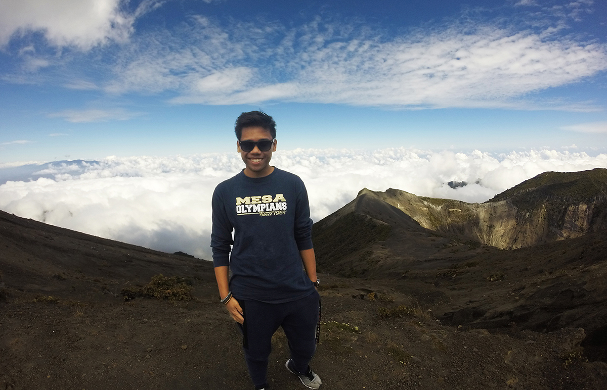 Mesa student Harley Sobreo on a mountain top in Costa Rica