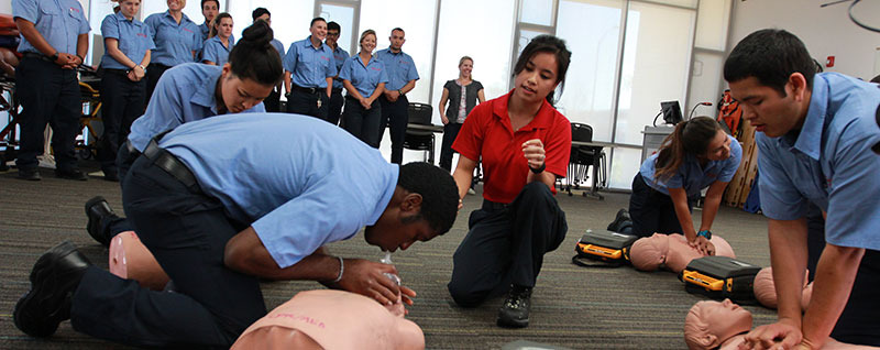 practicing cpr in an emt class
