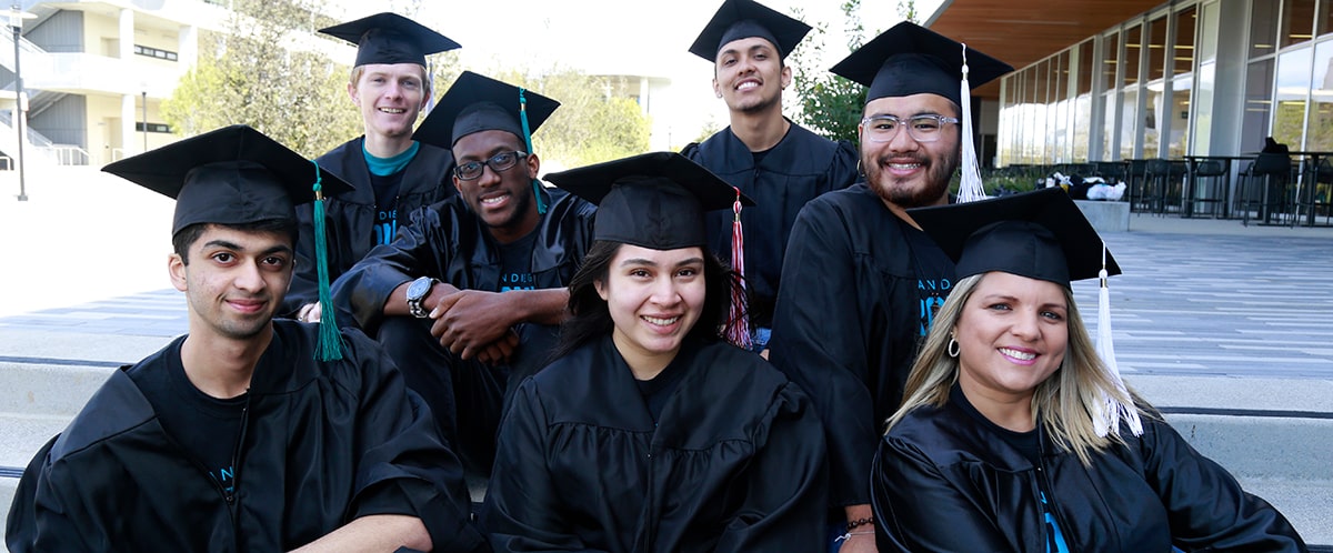 Promise students wearing graduation gowns and motorboards