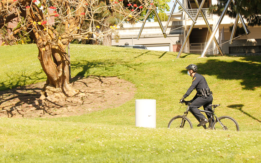 College Police on a bicycle patrolling a campus