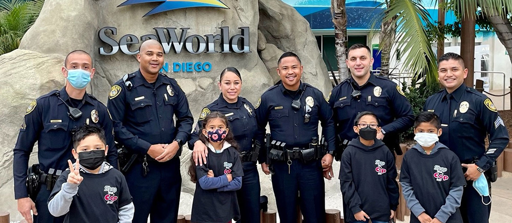 SDCCD Police officers in a group photo at Sea World for a Shop With a Cop event