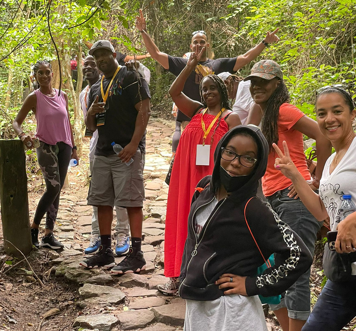 City College students pose for a group photo on a hiking trail in Ghana