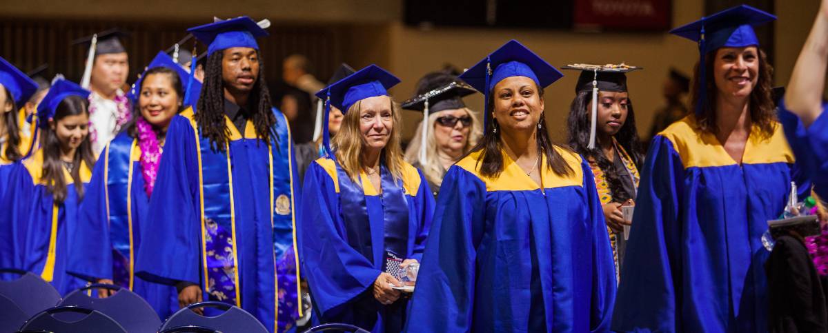 Students who were a part of the first Health Information Management baccalaureate program at Mesa College celebrate their completion during commencement in 2016.