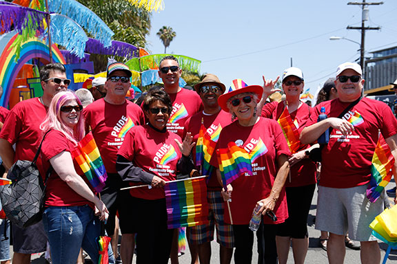 The chancellor, presidents, and the board of trustees celebrate at the annual pride parade