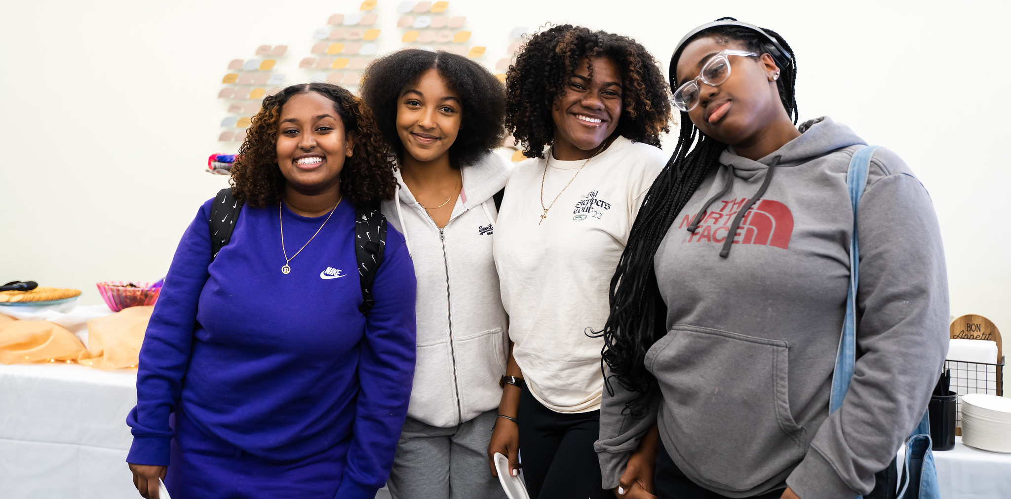 Four women pose for a group photo