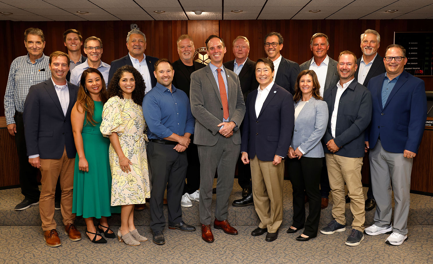 The chancellor with representatives from the firms.