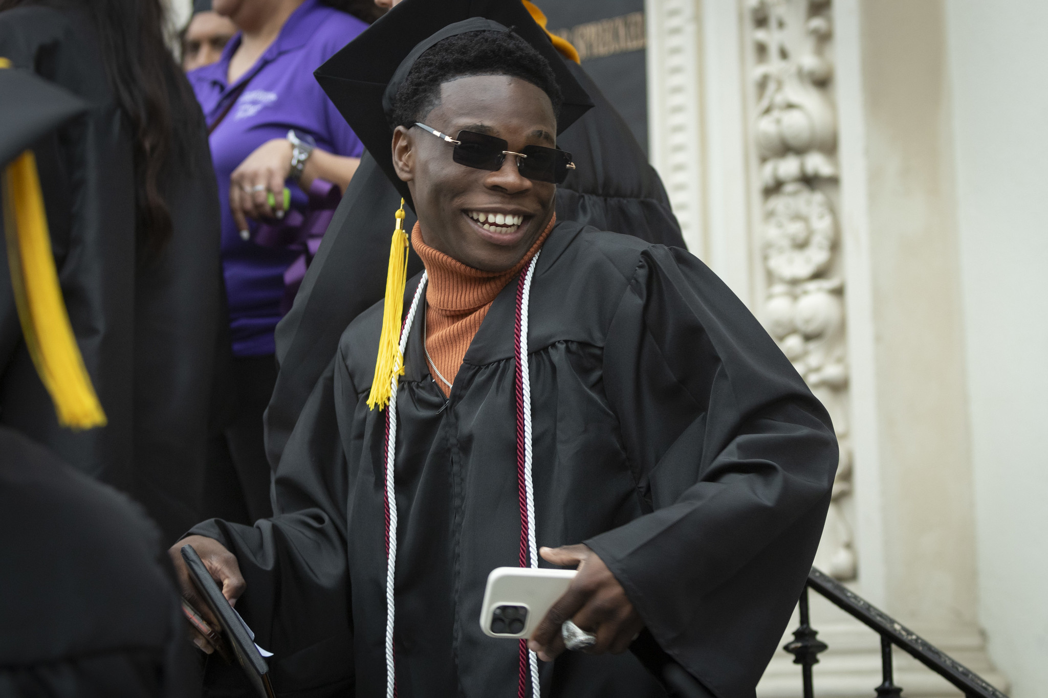 
A graduate smiling heads to the stage.
