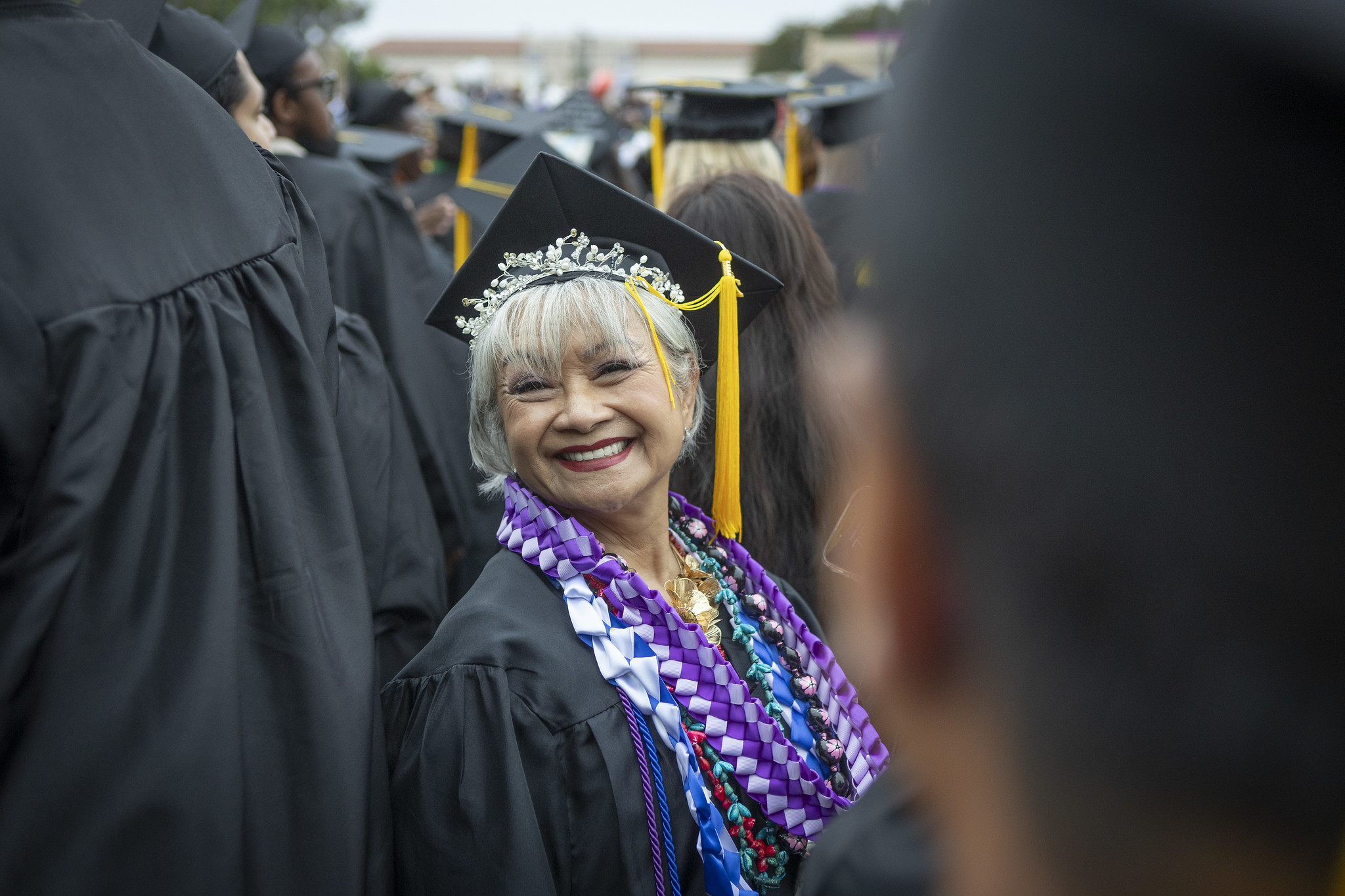 
A graduate smiling at commencement.
