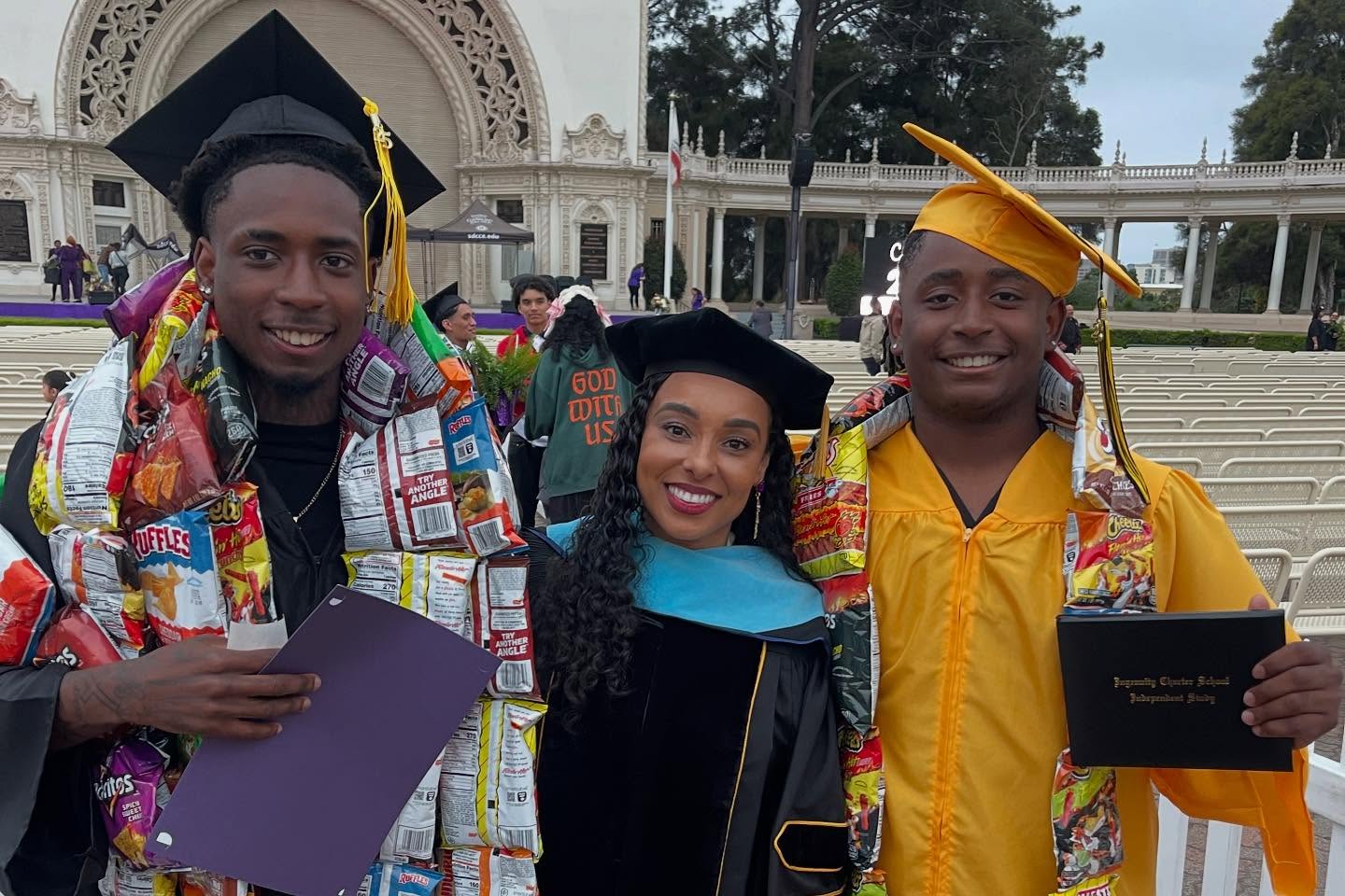 
College of Continuing Education President Tina King with two graduates.
