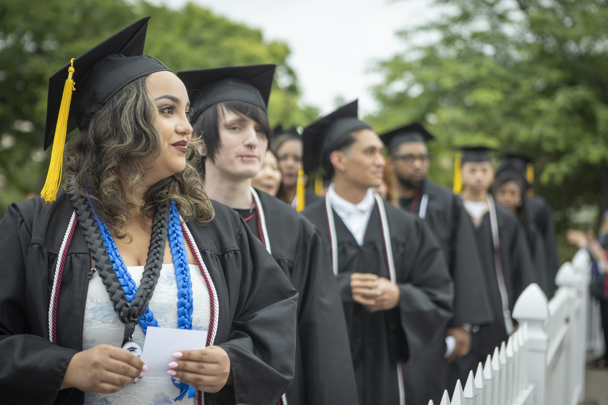 
Six graduates lined up to go on stage to receive their certificates.
