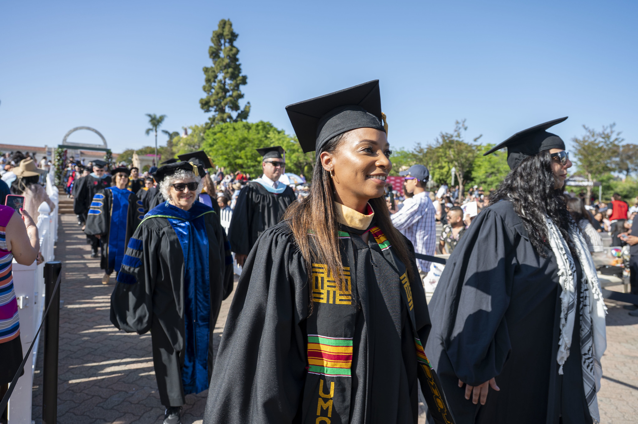 
Trustee Mariah Jameson walks toward the stage.
