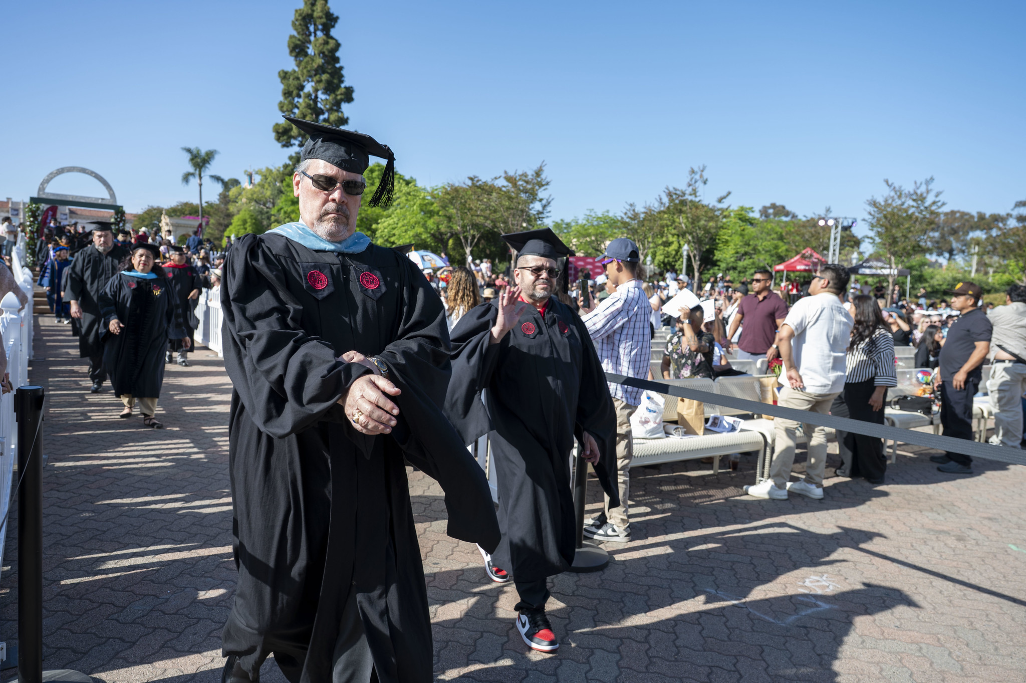 
Trustee Maria Nieto Senour heads to the stage.
