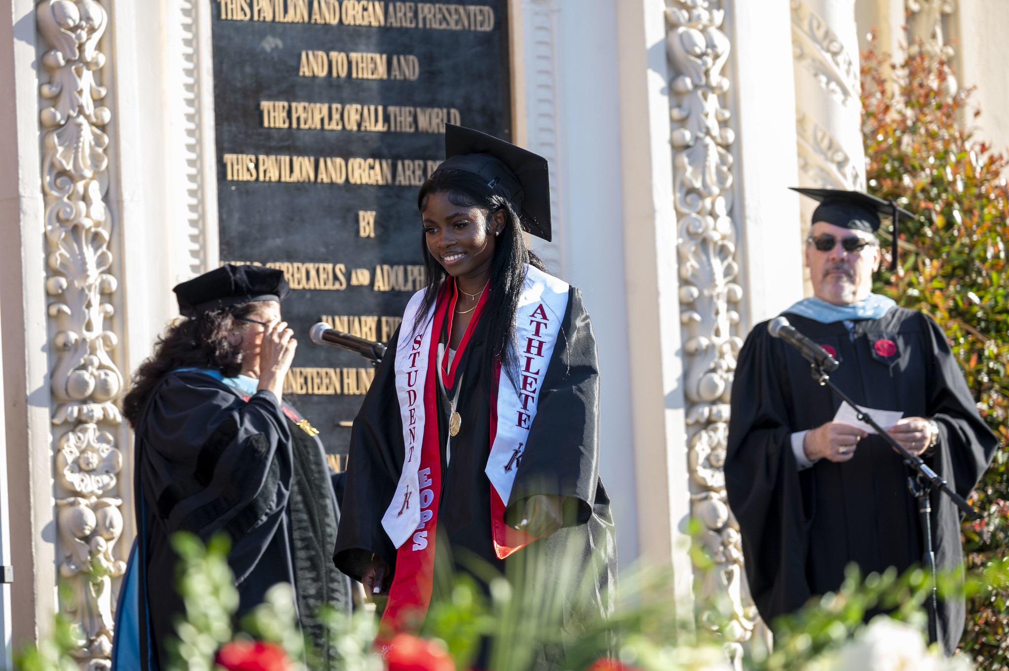 
A graduate walking across the stage.
