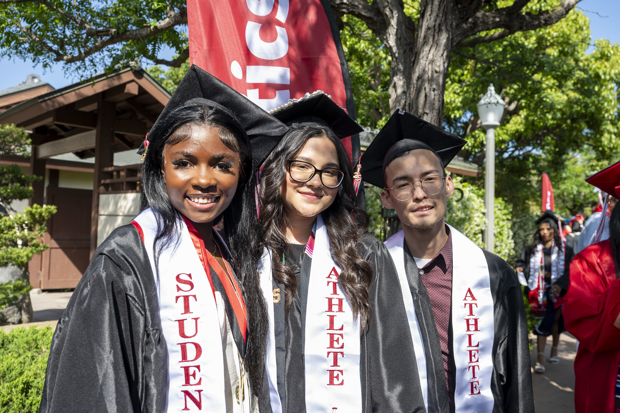 
Three student athletes wait for the ceremony to begin.

