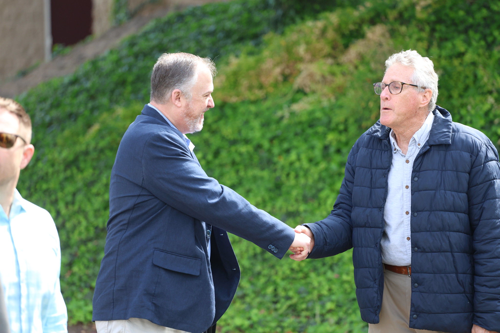 
Two men shaking hands at the groundbreaking
