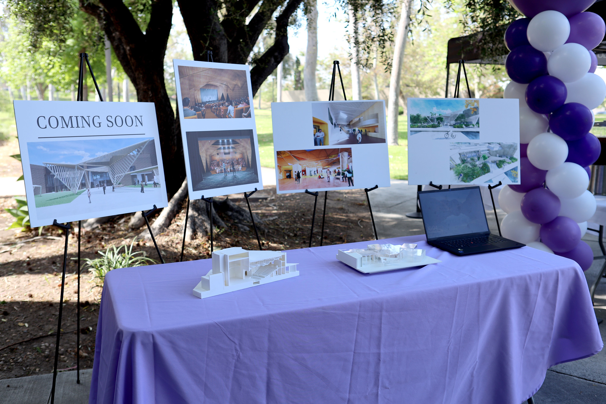 
Four eisels holding renderings of the renovated theater.
