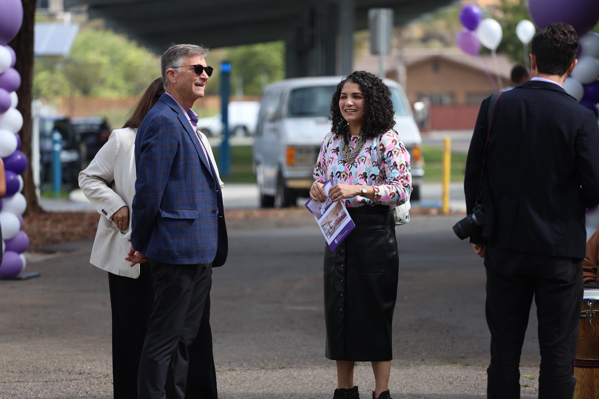 
Attendees chatting at the event.
