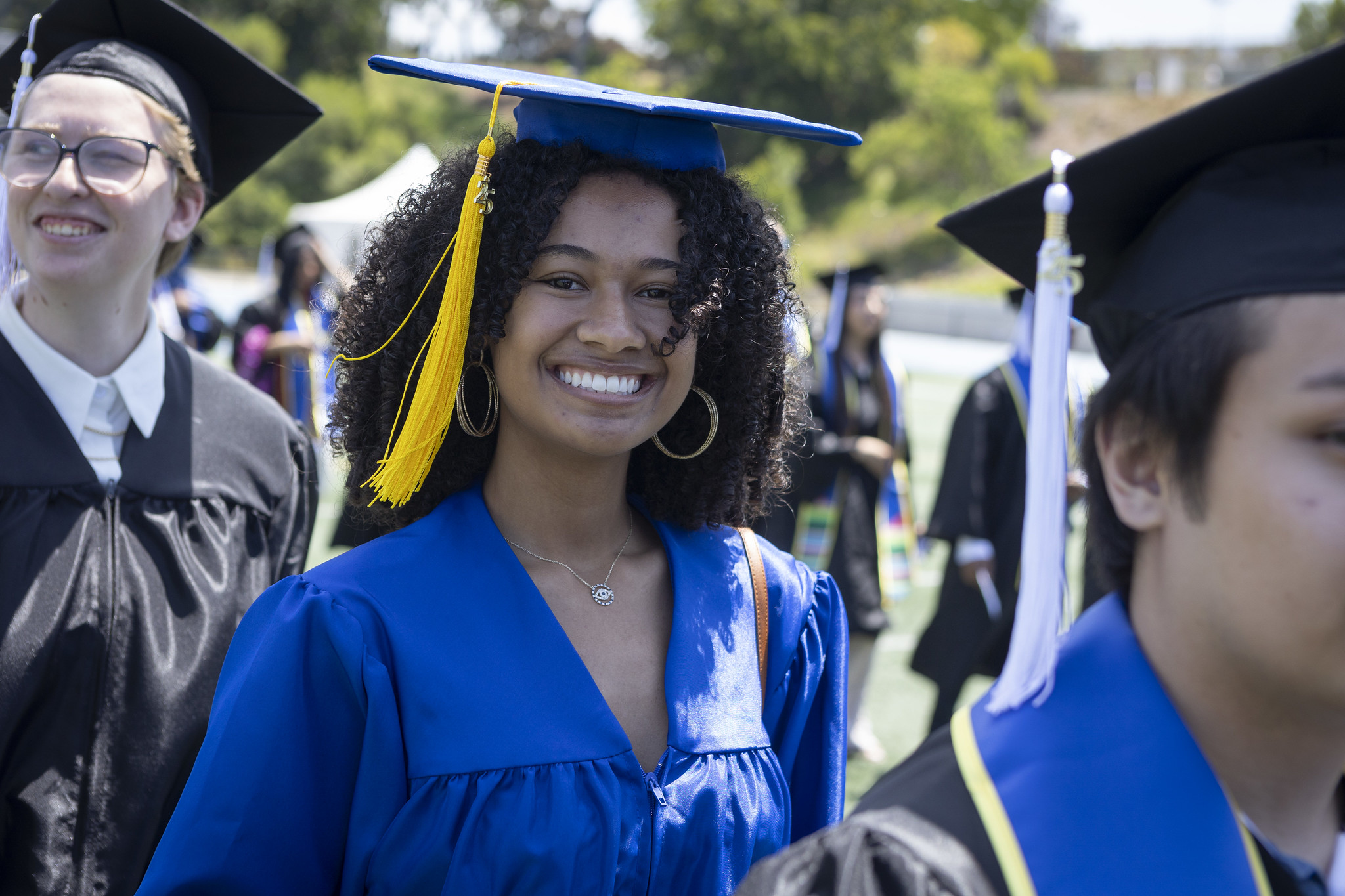 
A graduate walks to her seat.
