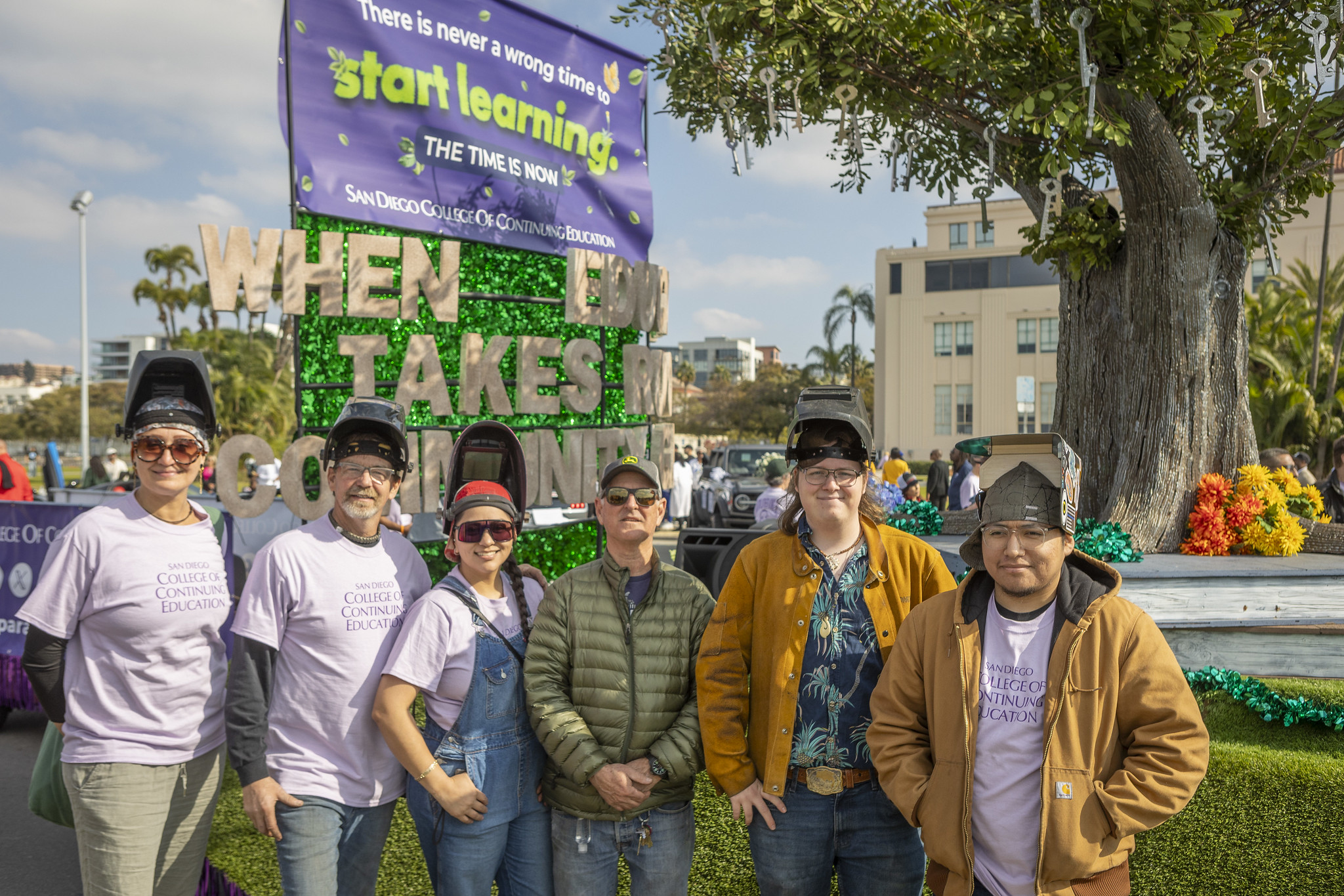 Six student welders who worked on the parade float