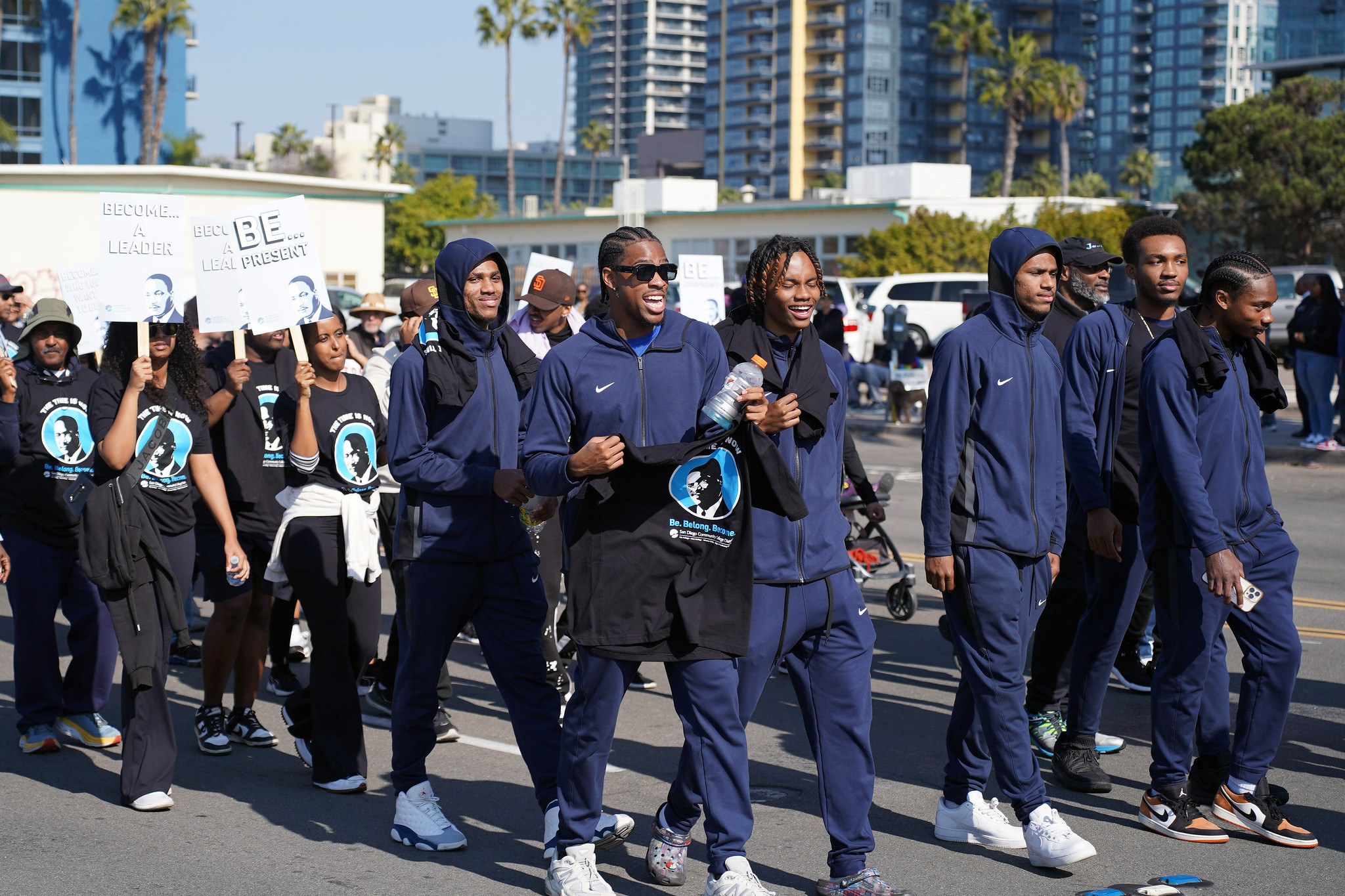 A group of student athletes walk in the parade.