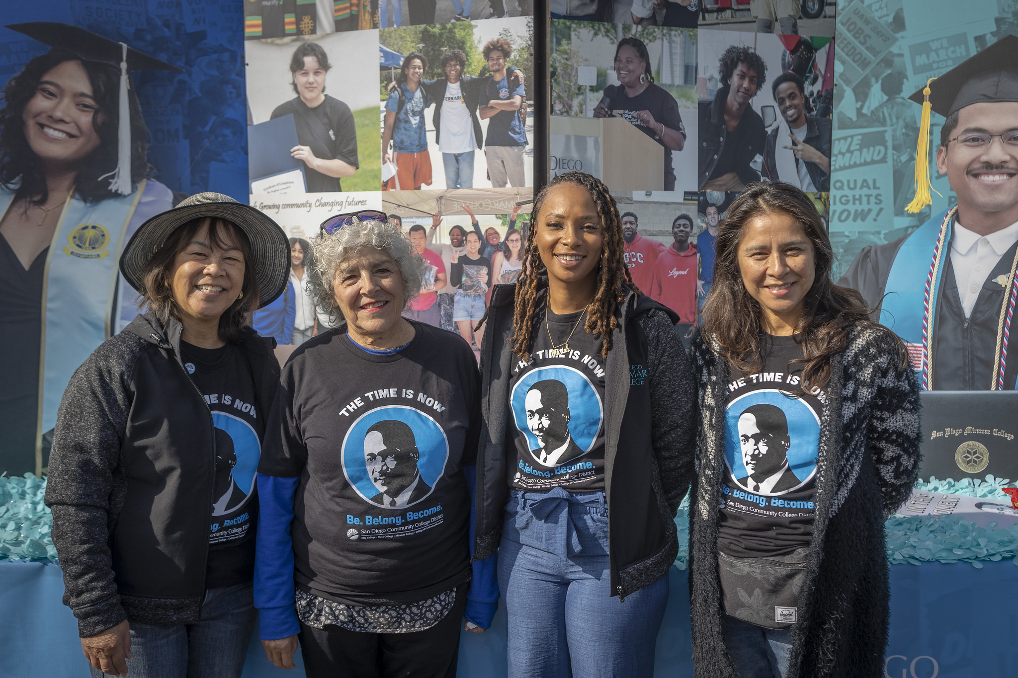 Four trustees in front of a float
