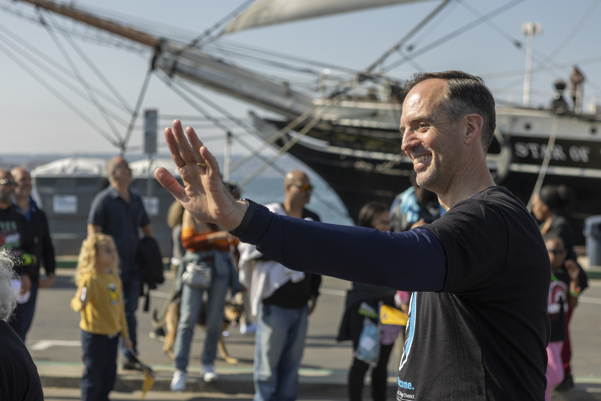 Chancellor Gregory Smith waves while walking in the parade.