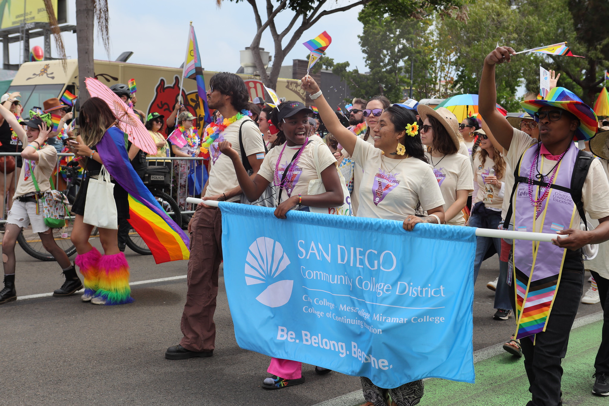 
Students hold the blue district banner at the front of the SDCCD contingent at the parade.
