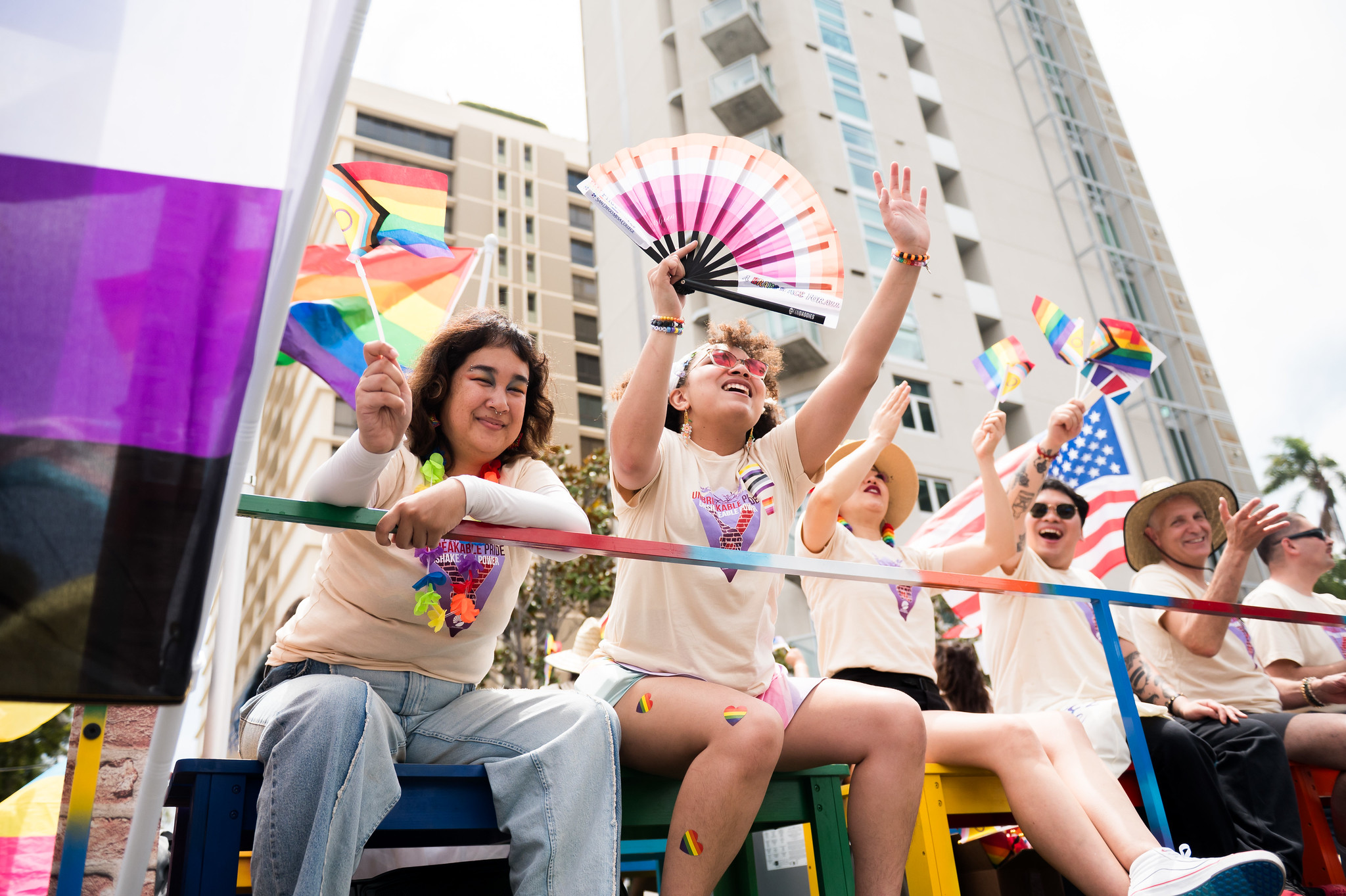 
People on the SDCCD float wave to the crowd.
