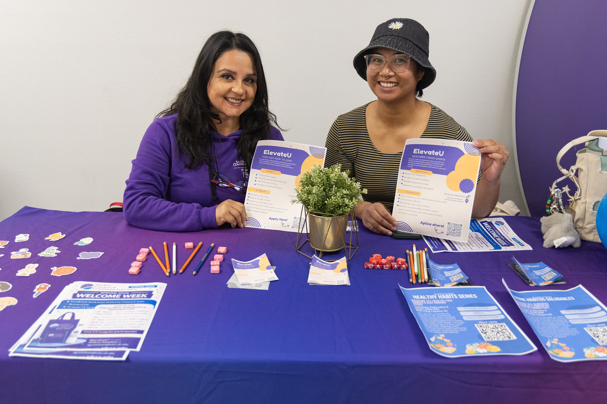 
Two ladies working at a welcome table at Continuing Education.
