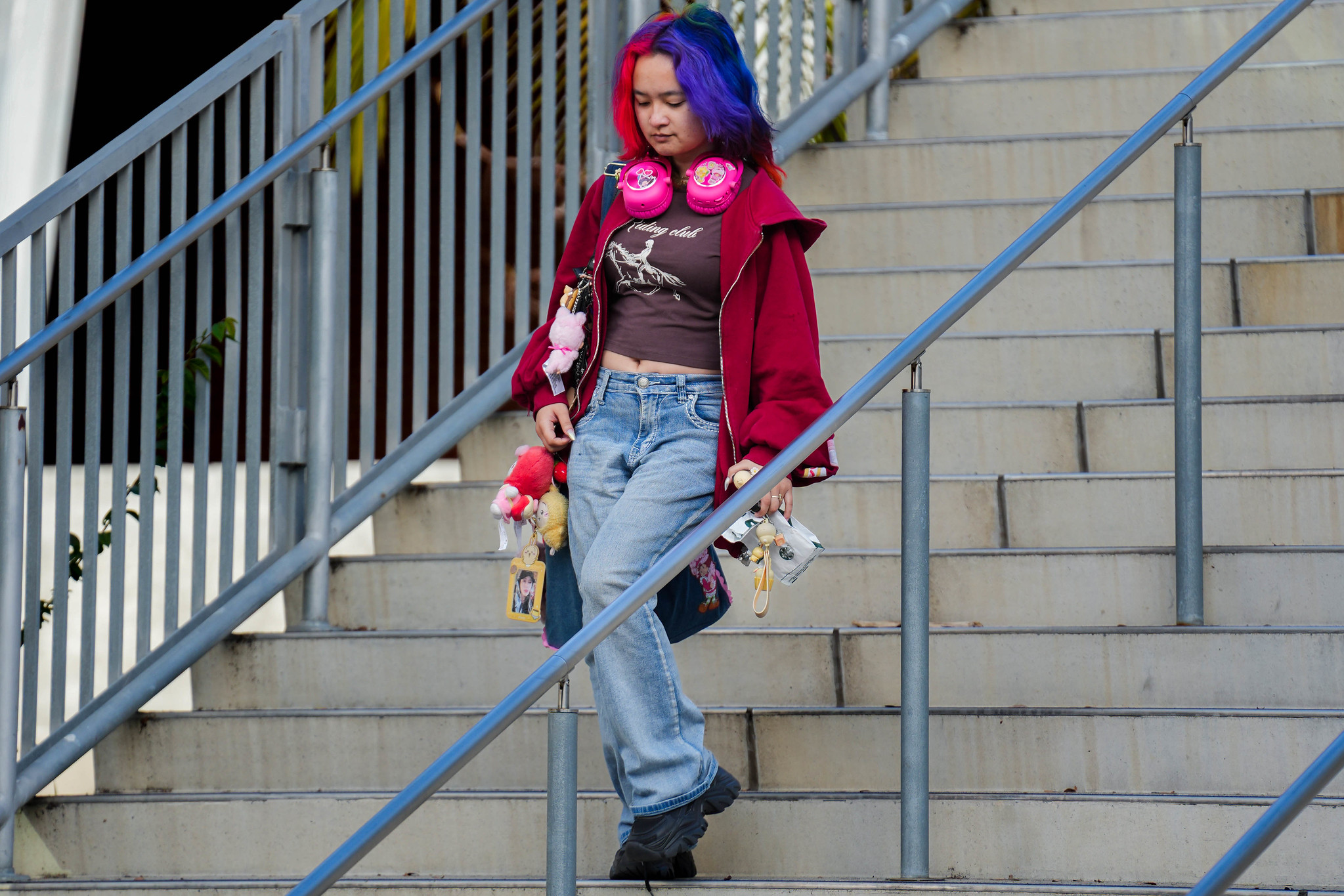 
A student walks down stairs at City College.
